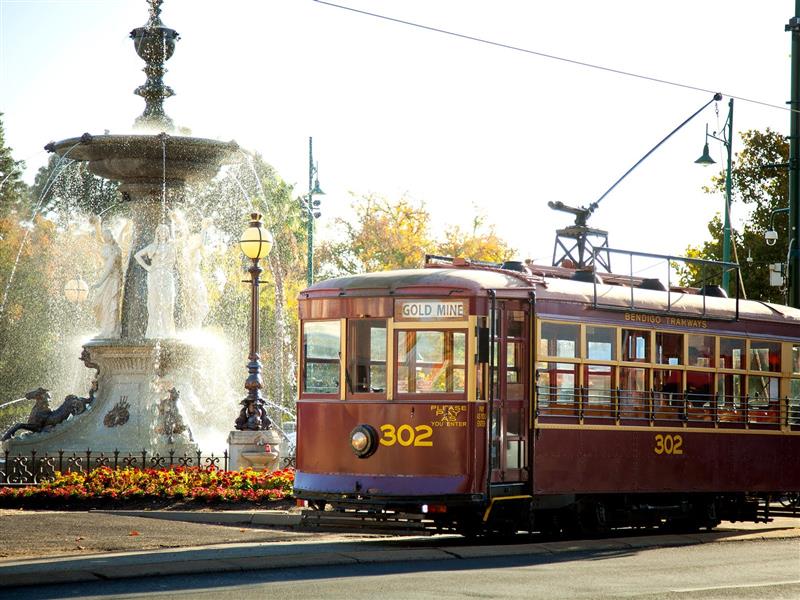 Vintage Talking Tram passing Alexandra Fountain
