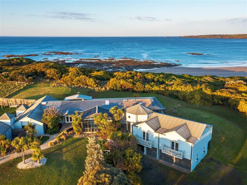 Exterior of house and view of ocean