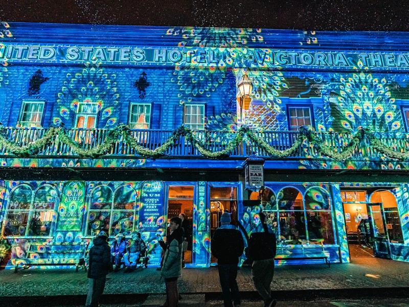 Lights projected on United States Hotel and Victoria Theatre building