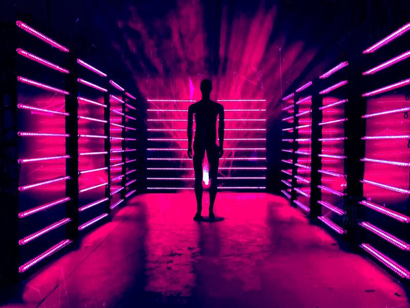 Dark figure standing in lights