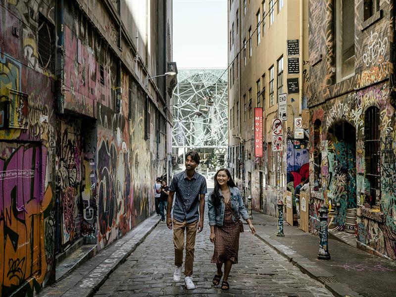couple walking up hosier lane, Melbourne, Victoria, Australia