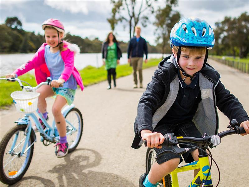 Kids cycling at Barwon River and Park, Victoria, Australia